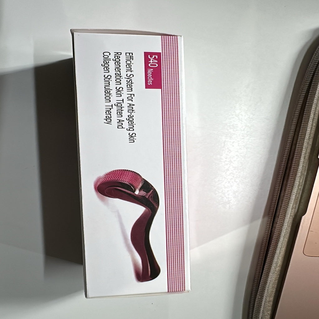Wukusy 540 Micro Needle Derma Roller used for skin care routine with fine needles for facial rejuvenation and skin improvement.