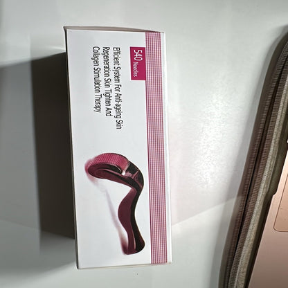 Wukusy 540 Micro Needle Derma Roller used for skin care routine with fine needles for facial rejuvenation and skin improvement.