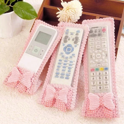 Wukusy 3-piece remote cover set with bow knot for TV and air conditioner remote controls, dust-resistant protective covers.