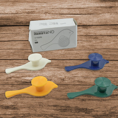 Set of four Wukusy bird-shaped self-adhesive wall hooks for towels, hats, coats, and keys, mounted on a wall.