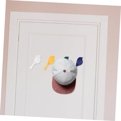 Set of four Wukusy bird-shaped self-adhesive wall hooks for towels, hats, coats, and accessories in a decorative wall-mounted design.