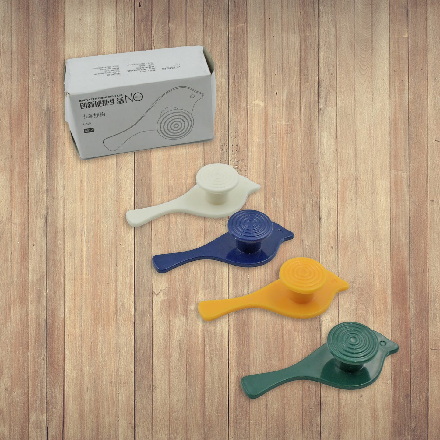 Wukusy 7772 bird-shaped self-adhesive wall hooks set with four hooks for towels, hats, coats, and accessories.