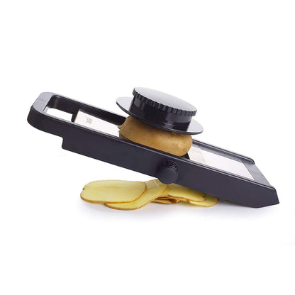 Wukusy Ganesh adjustable plastic slicer in black and silver, 1-piece kitchen tool for slicing fruits and vegetables.