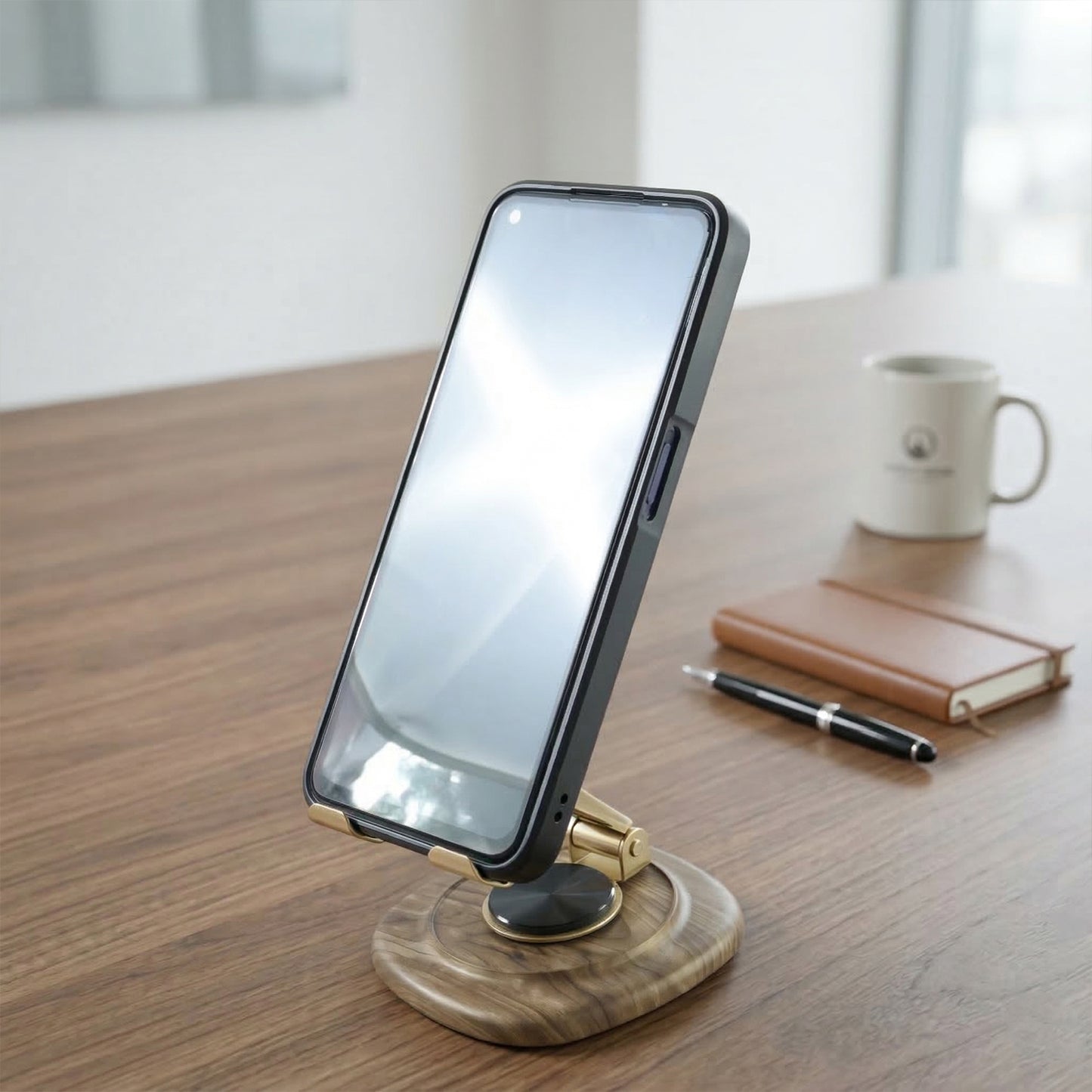 Wukusy adjustable metal desk phone stand with plastic base, holding a smartphone in a portrait position on a desk.