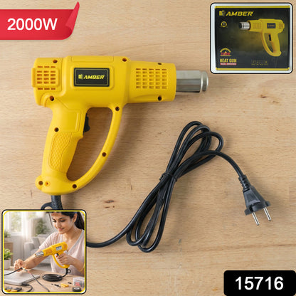 Wukusy Amber Heat Gun AMHG2000, 2000W industrial heat gun held in hand, ready for use in heating or shrinking tasks.
