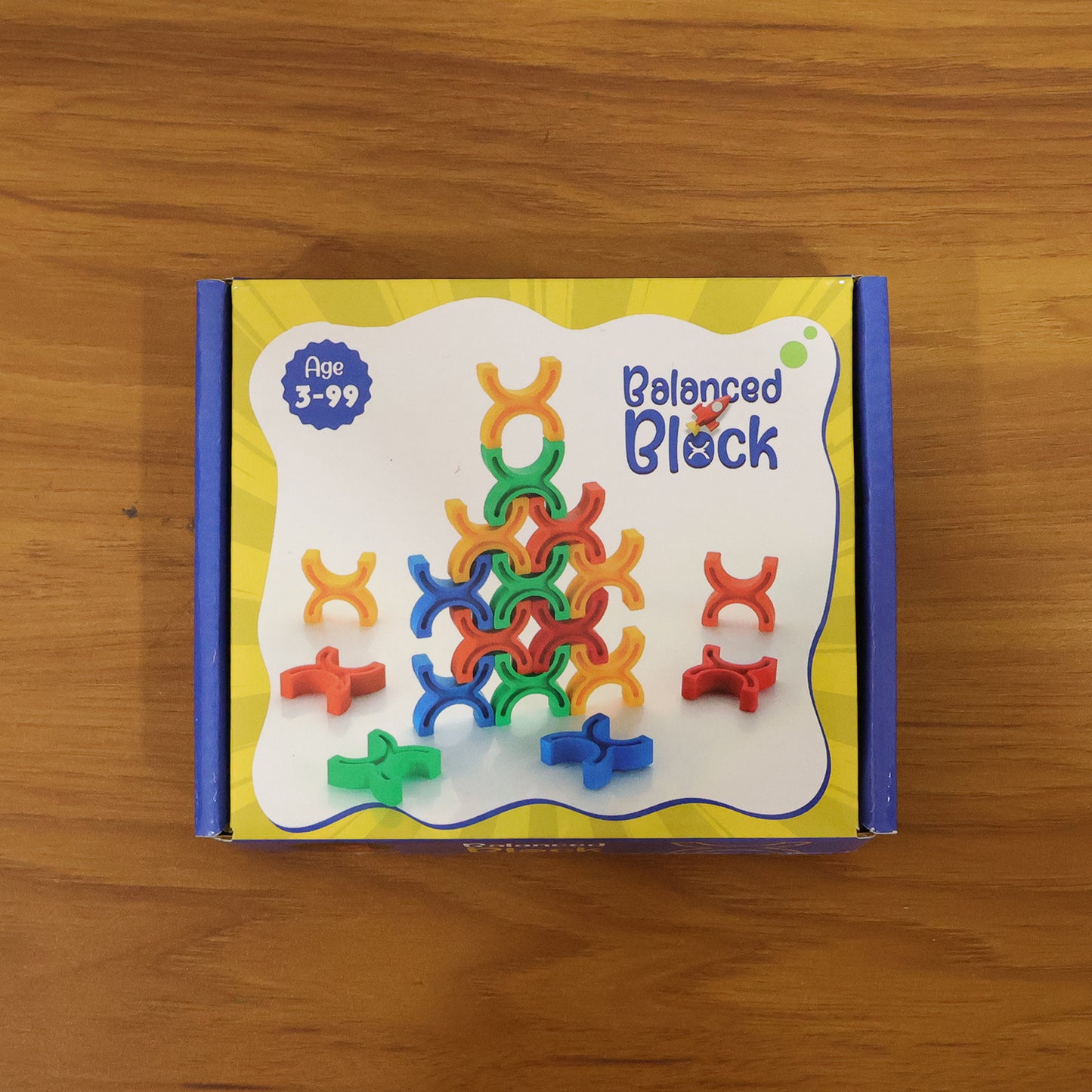 Colorful interlocking stacking toy set by Wukusy featuring balanced, brightly colored blocks for creative play and coordination.