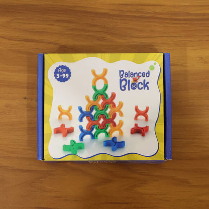 Colorful interlocking stacking toy set by Wukusy featuring balanced, brightly colored blocks for creative play and coordination.