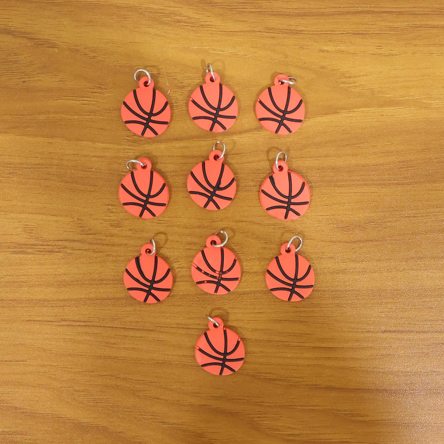 Wukusy basketball design bag charm keychain set featuring 10 colorful basketball-themed accessories for bags and keys.