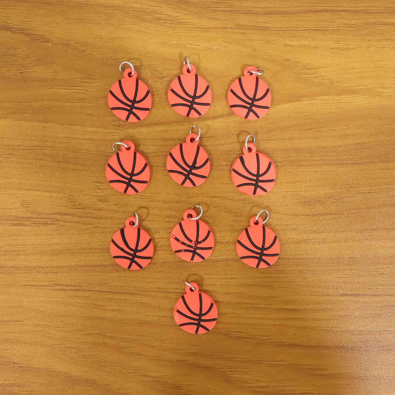 Wukusy basketball design bag charm keychain set featuring 10 colorful basketball-themed accessories for bags and keys.