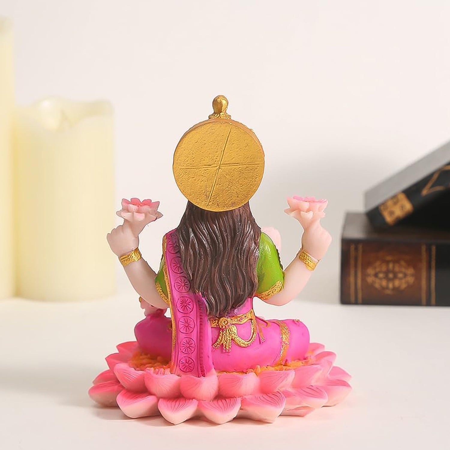 Decorative Lakshmi Mata idol sitting on a lotus flower, crafted by Wukusy, ideal for home decor and spiritual ornamentation.