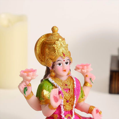 Decorative Lakshmi Mata idol sitting on a lotus flower, crafted by Wukusy, ideal for home decor or spiritual ambiance.