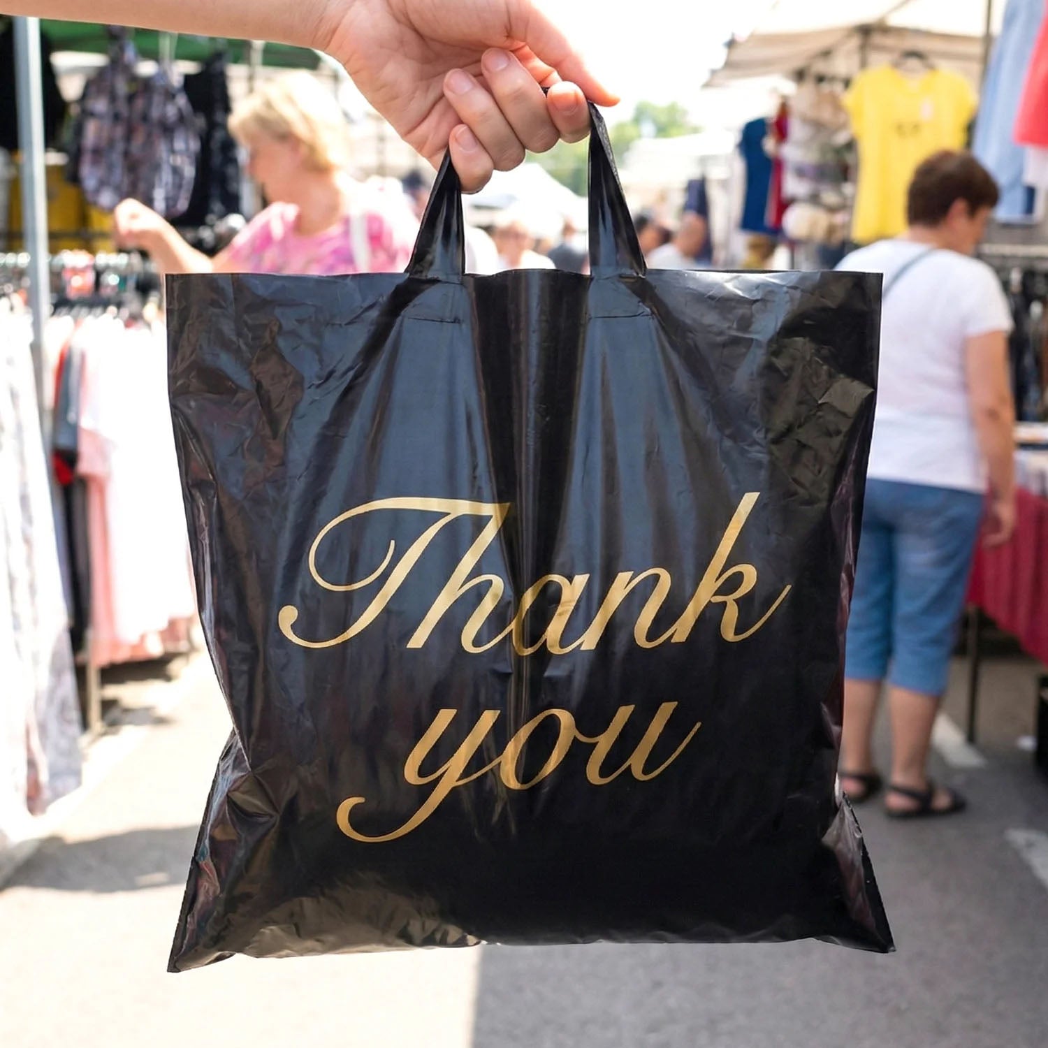 Set of four black Wukusy thank you printed carry bags in mixed sizes, perfect for gifting or retail packaging.