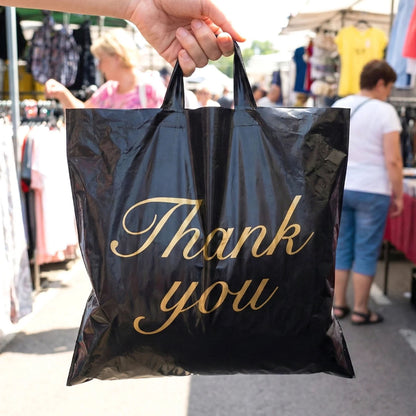 Set of four black Wukusy thank you printed carry bags in mixed sizes, perfect for gifting or retail packaging.