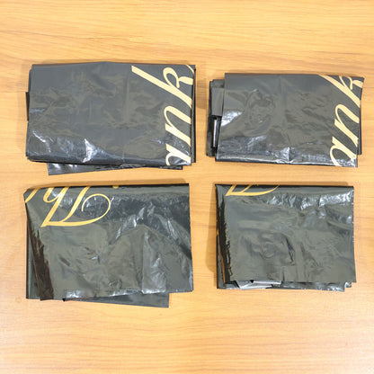 Set of four Wukusy black thank you printed carry bags in mixed sizes for gift packaging and shopping needs.