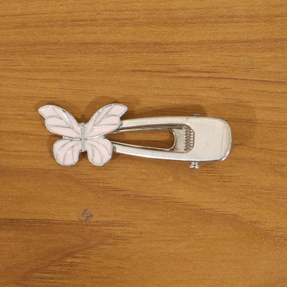 Metal butterfly design hair clip by Wukusy, showcasing a decorative silver hair accessory with a detailed butterfly shape.