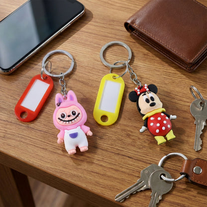 Cartoon character keychain with a customizable name tag from Wukusy, featuring a colorful mix design and a metal keyring attachment.