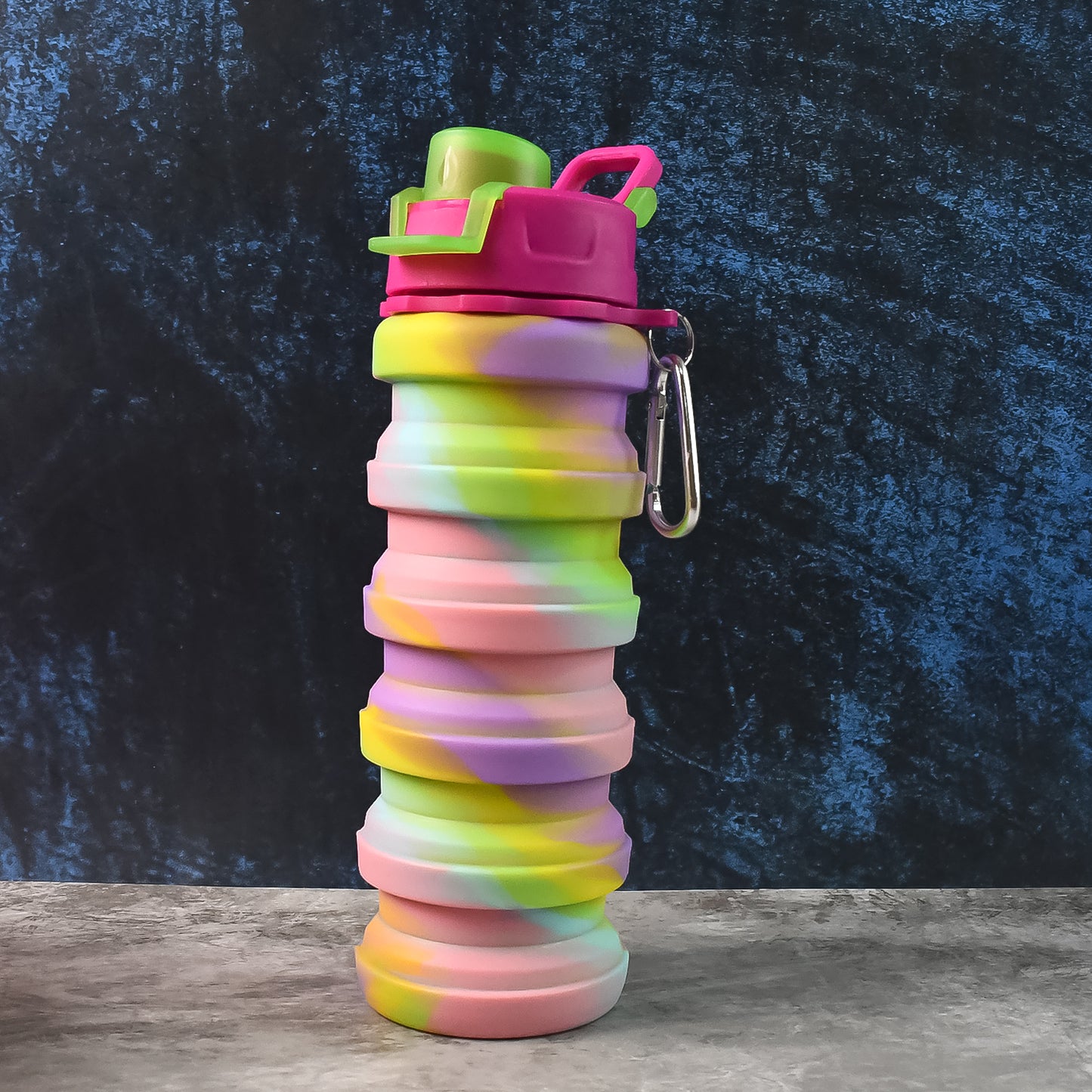 Colorful collapsible silicone water bottle by Wukusy, folded and expanded, showing flexible design and vibrant colors.