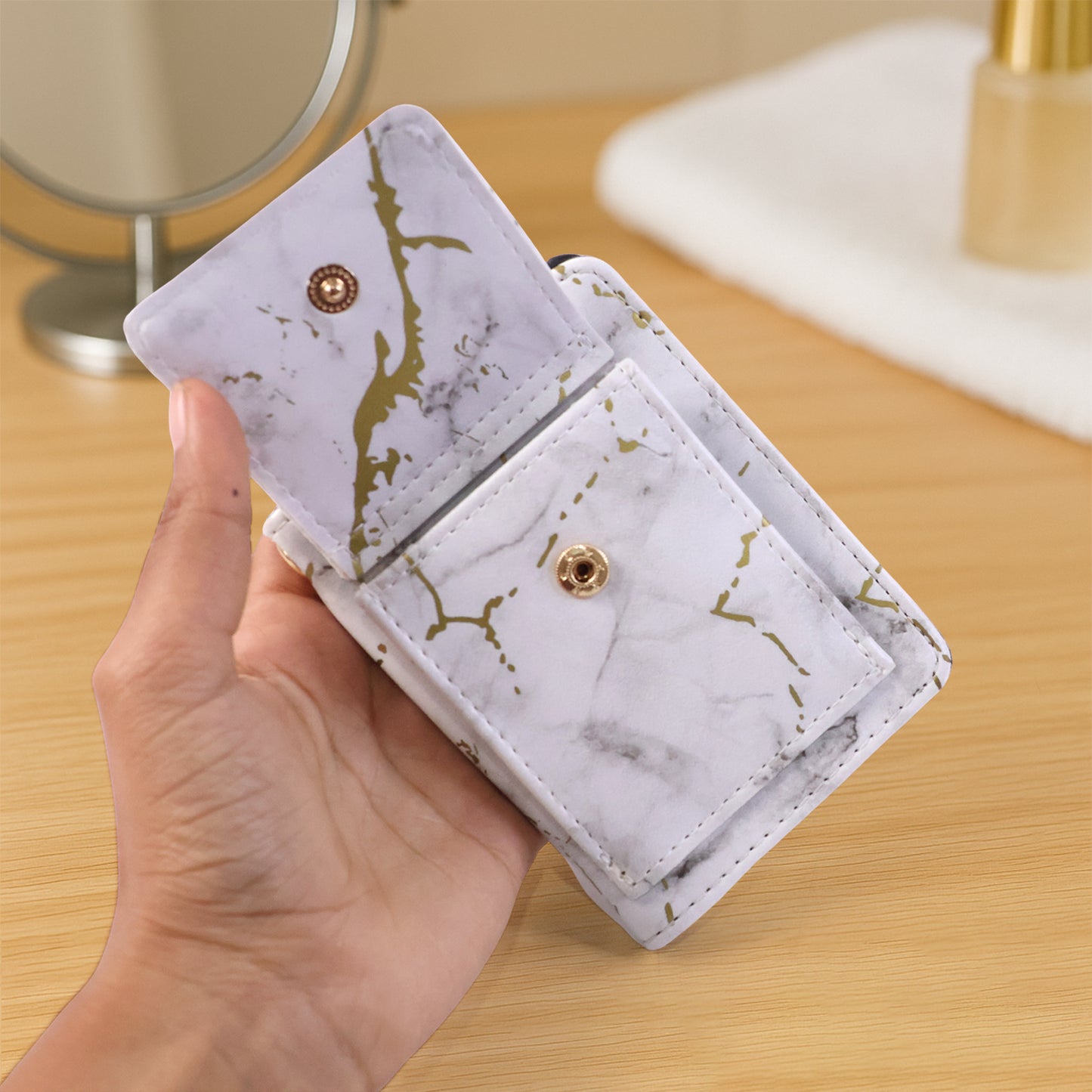 Wukusy compact marble finish snap button card holder wallet with multiple card slots and sleek design.