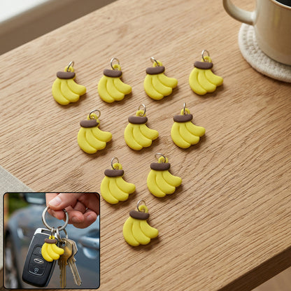 Set of 10 Wukusy cute banana-shaped bag charm keychains with colorful, playful designs for accessories and decoration.