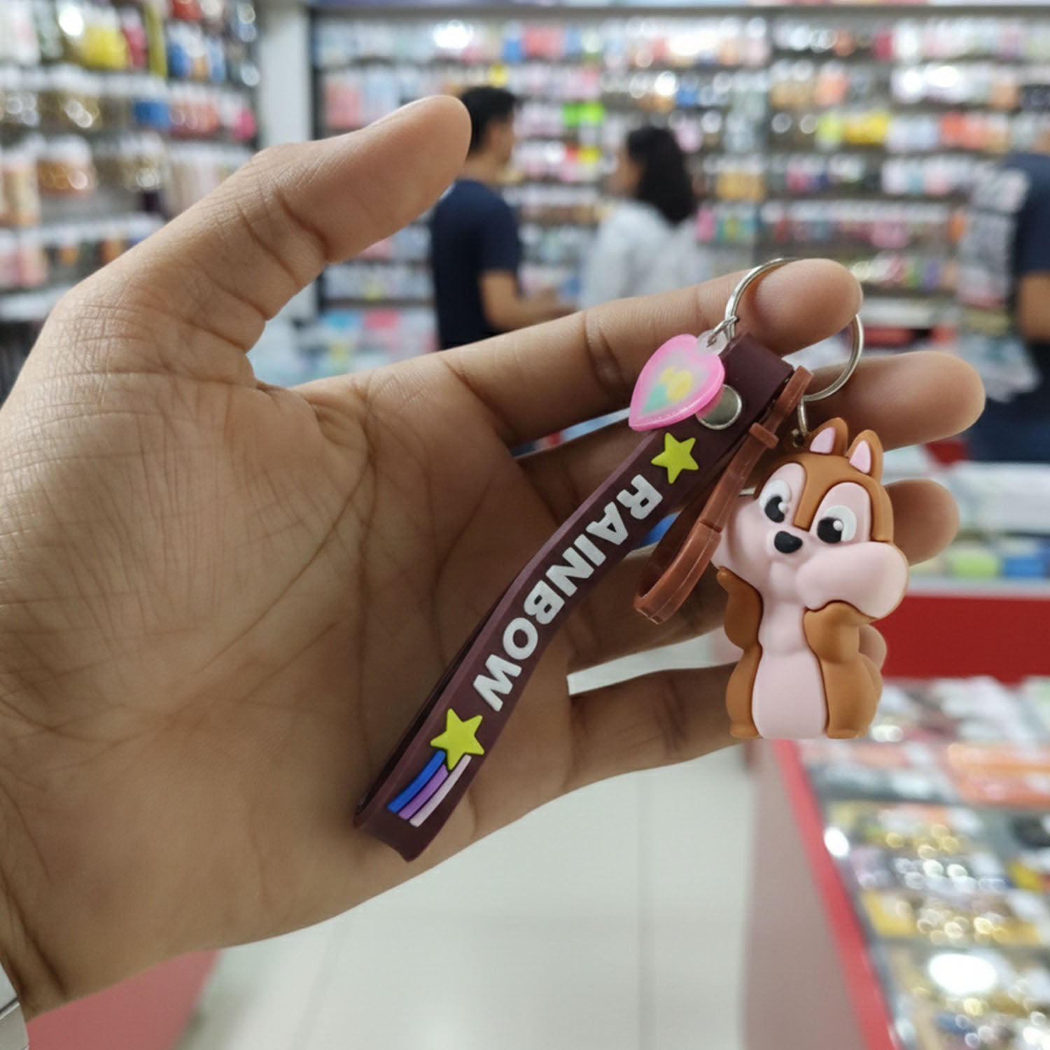Cute cartoon animal silicone keychain with rainbow strap from Wukusy, featuring a colorful, playful design on a soft silicone surface.