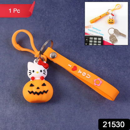 Cute cartoon cat pumpkin-themed silicone keychain from Wukusy, featuring a colorful feline design on a small, durable accessory.