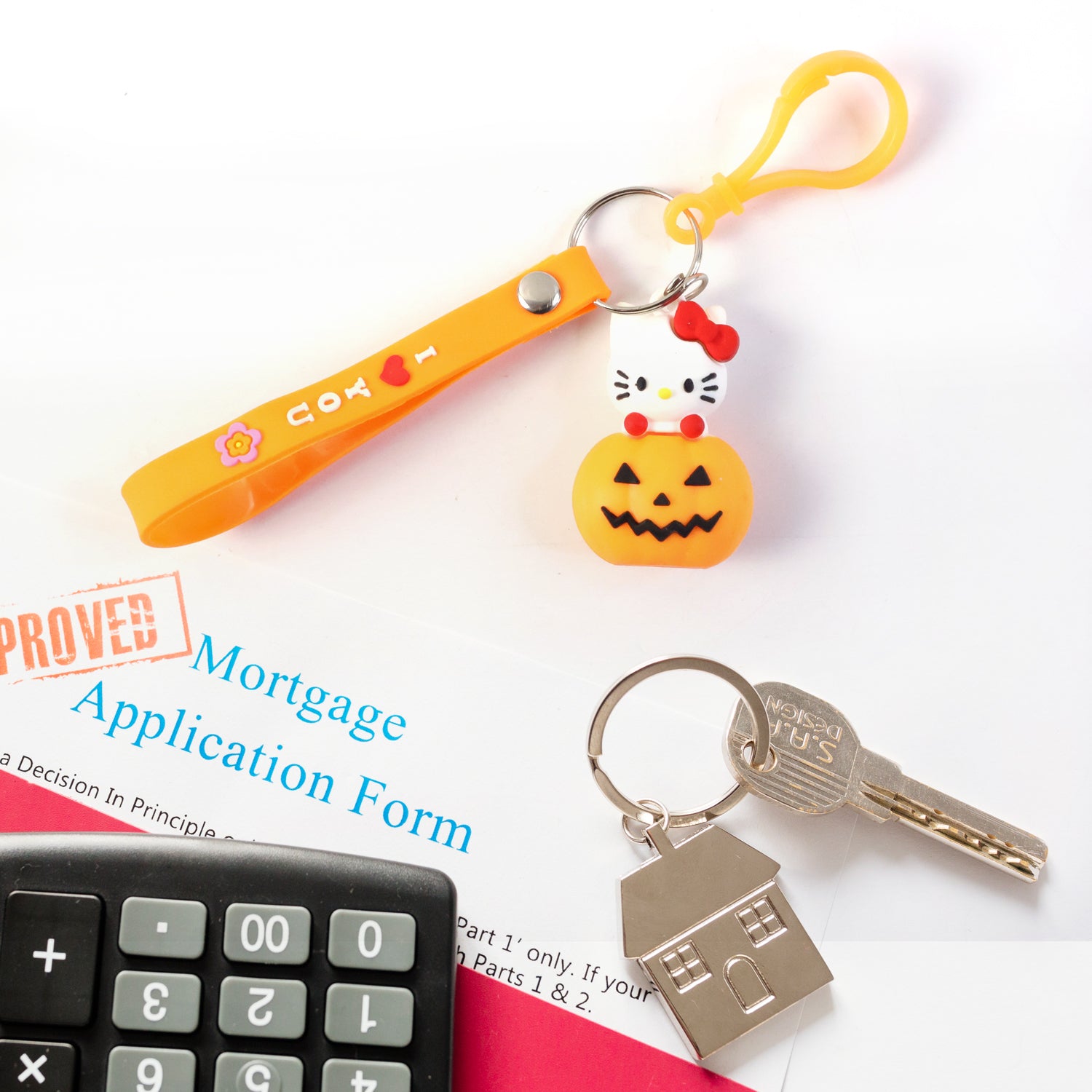 Cute cartoon cat pumpkin-themed silicone keychain by Wukusy featuring a colorful cat design and pumpkin motif.