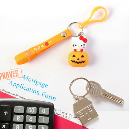 Cute cartoon cat pumpkin-themed silicone keychain by Wukusy featuring a colorful cat design and pumpkin motif.