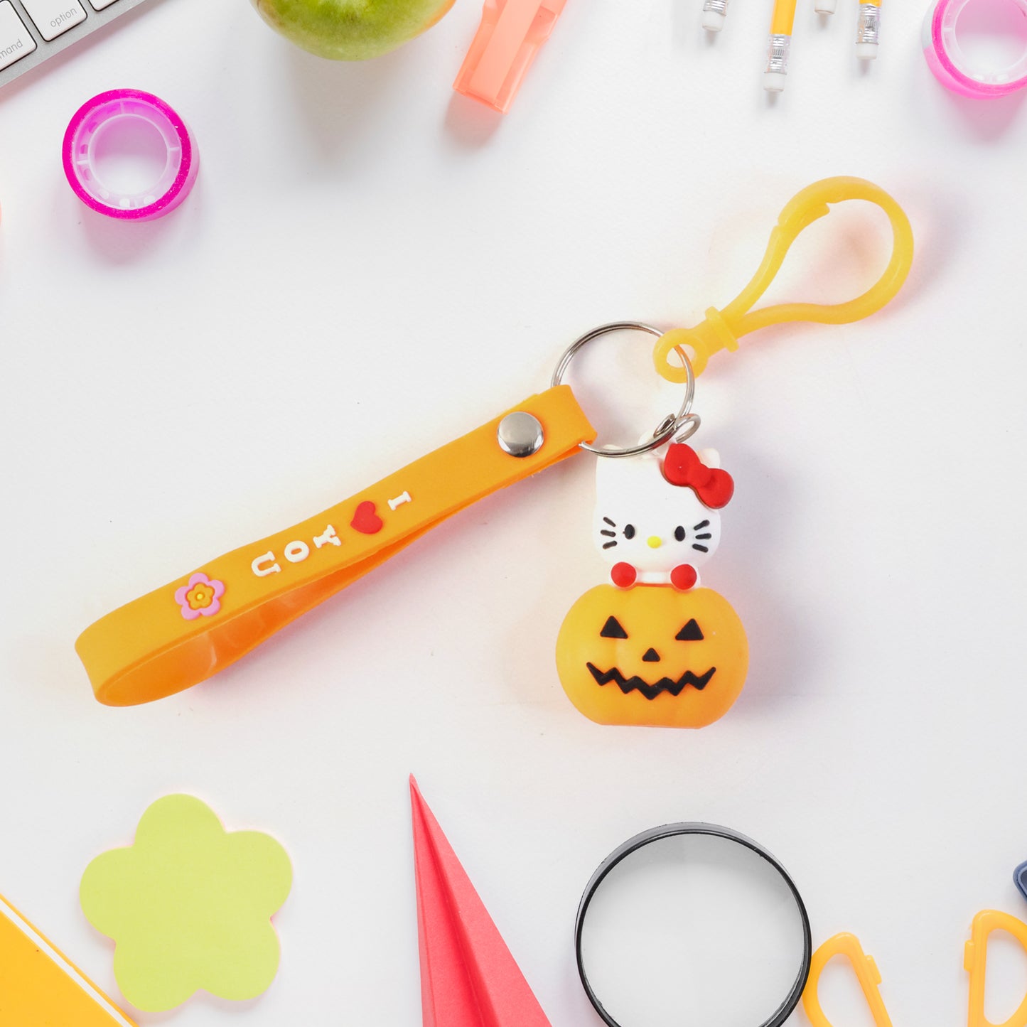Cute cartoon cat pumpkin-themed silicone keychain by Wukusy featuring a colorful, playful design with a cartoon cat and pumpkin motif.