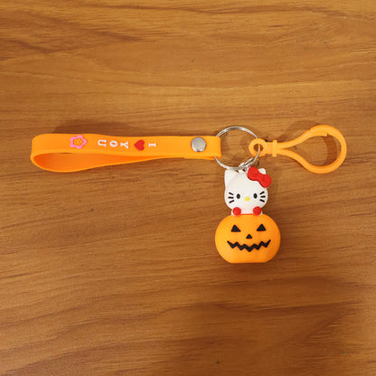 Cute cartoon cat pumpkin-themed silicone keychain by Wukusy, featuring a colorful cat design for keys or bags.