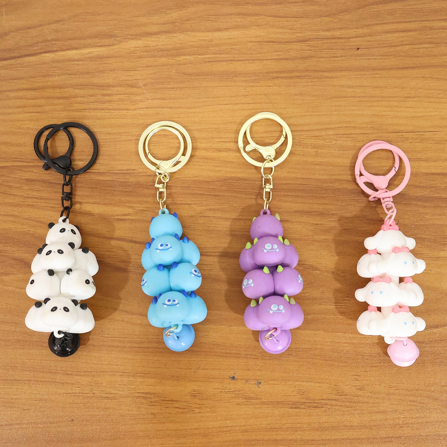 Colorful cartoon cloud stack keychain with bell from Wukusy, featuring a cute design and mixed bright colors.