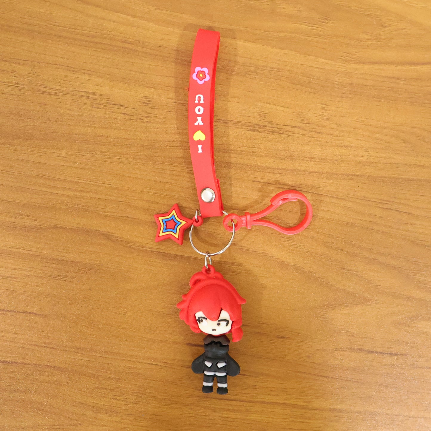 Wukusy cute cartoon girl character keychain with strap and decorative charm, featuring colorful design and playful details.