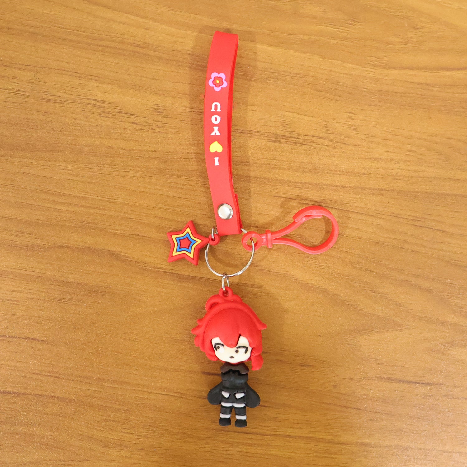 Wukusy cute cartoon girl character keychain with strap and decorative charm, featuring colorful design and playful details.