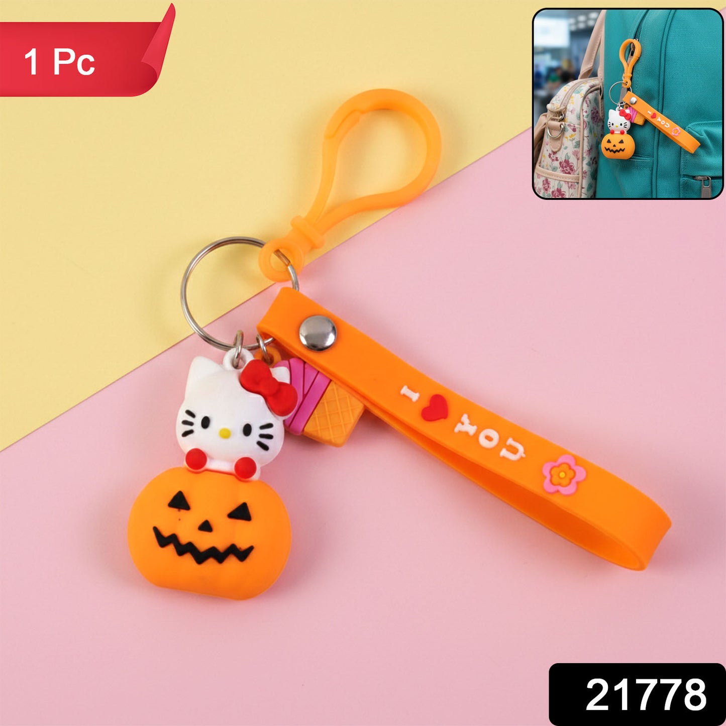 Cute cartoon kitty pumpkin keychain by Wukusy featuring a colorful, playful feline design on a small keyring.