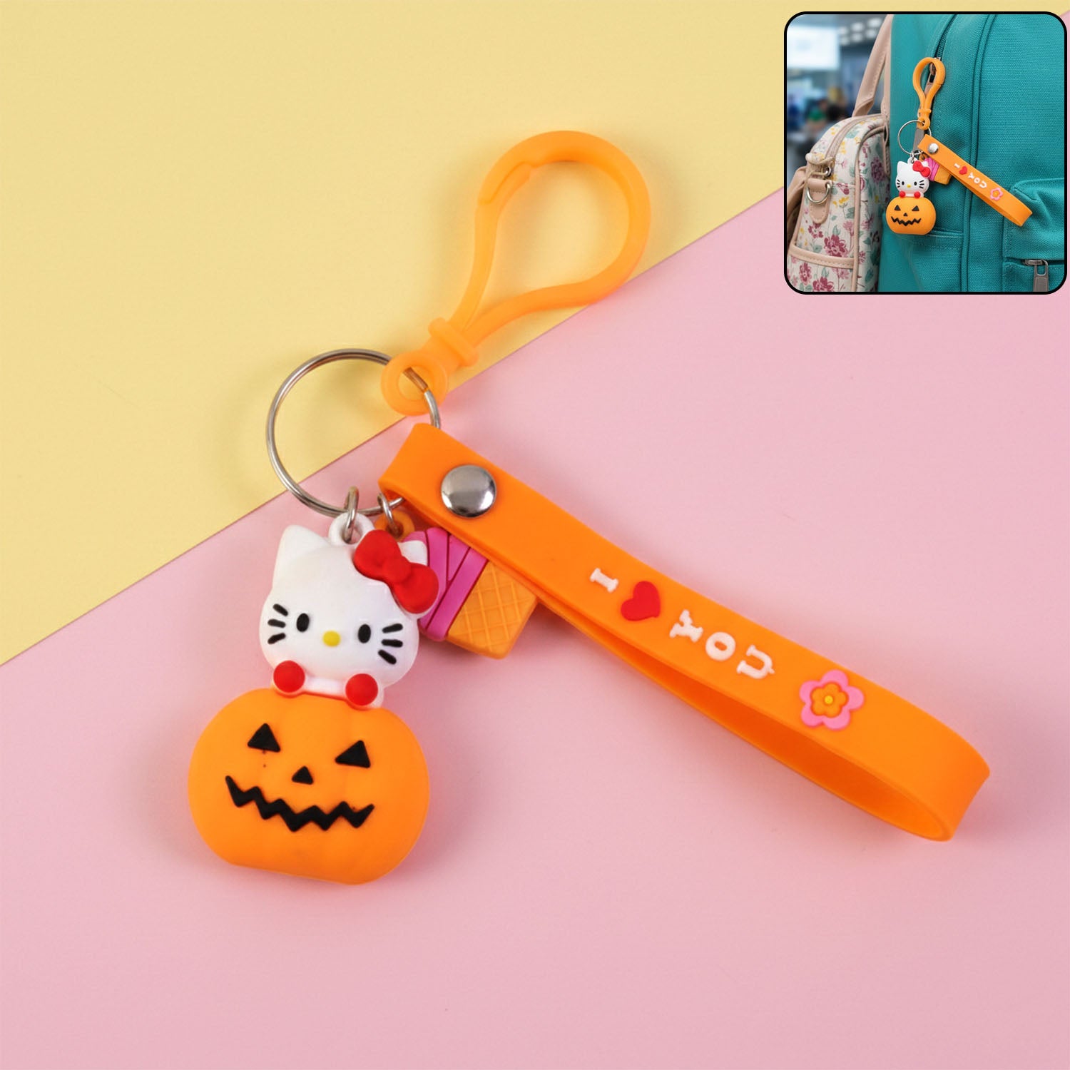 Wukusy cute cartoon kitty pumpkin keychain featuring a playful cat design on a small decorative keychain.