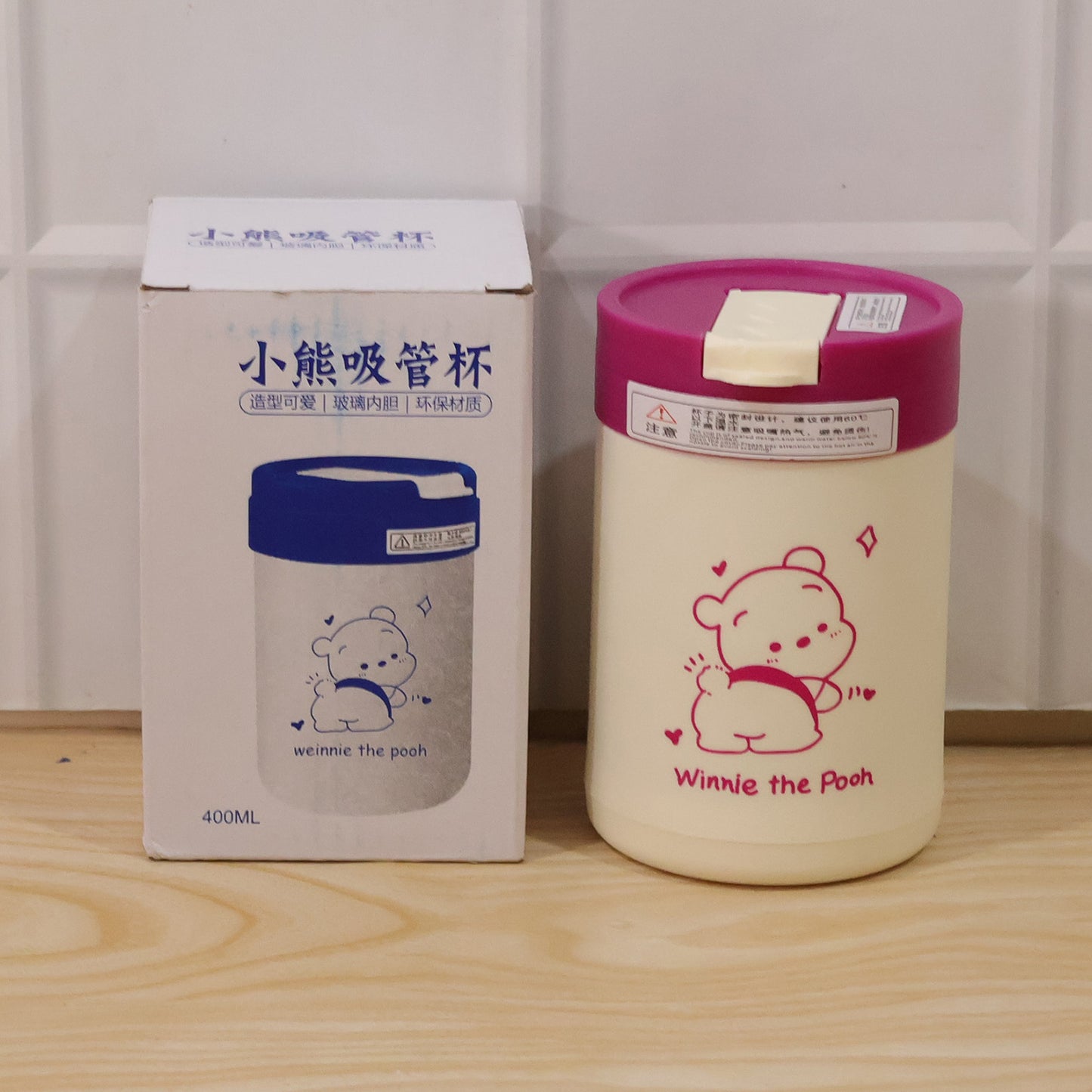 Wukusy cute cartoon printed glass tumbler with lid and straw, 400 ml capacity, featuring colorful cartoon design and clear glass body.