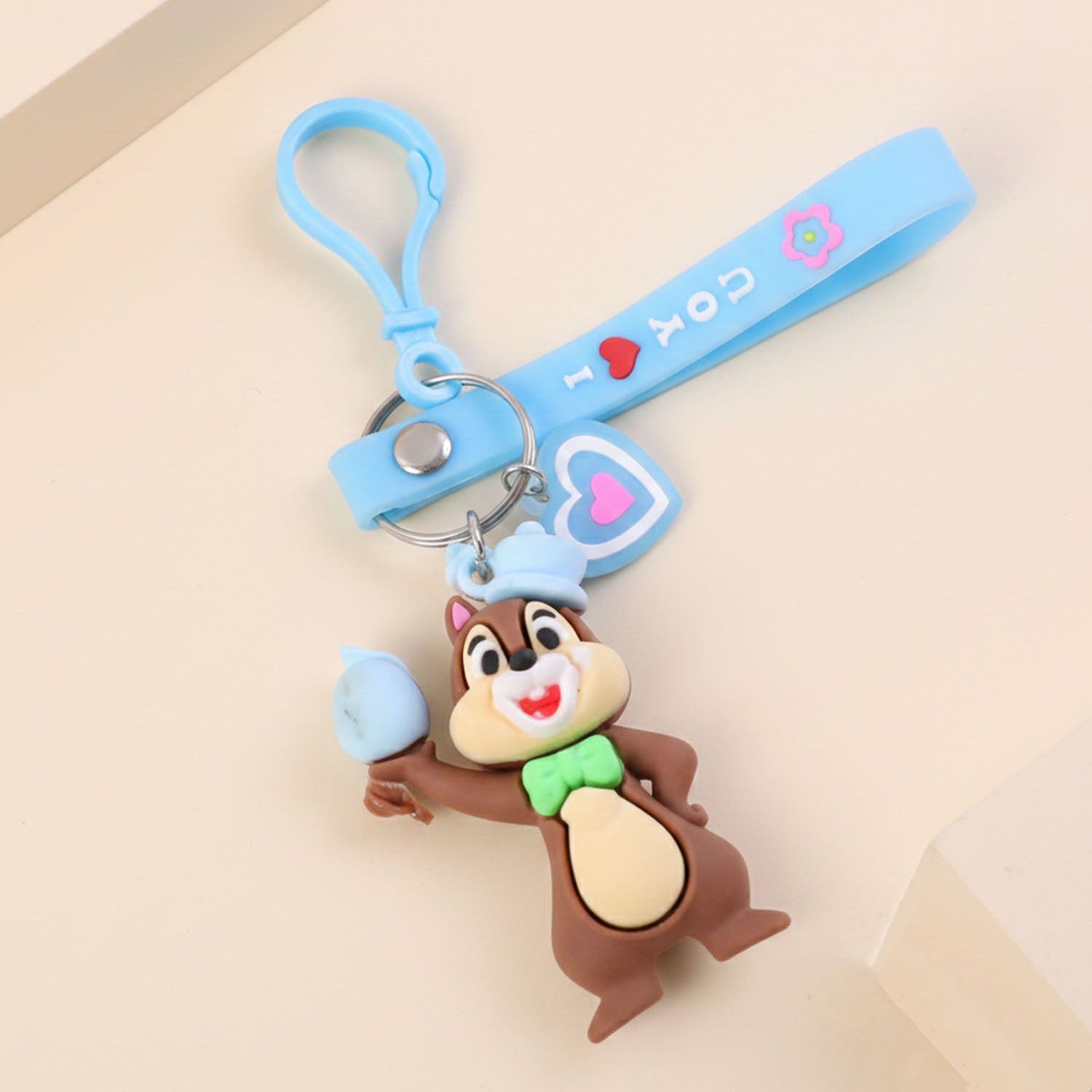Cute cartoon squirrel character keychain from Wukusy, featuring a detailed squirrel design on a small keyring.
