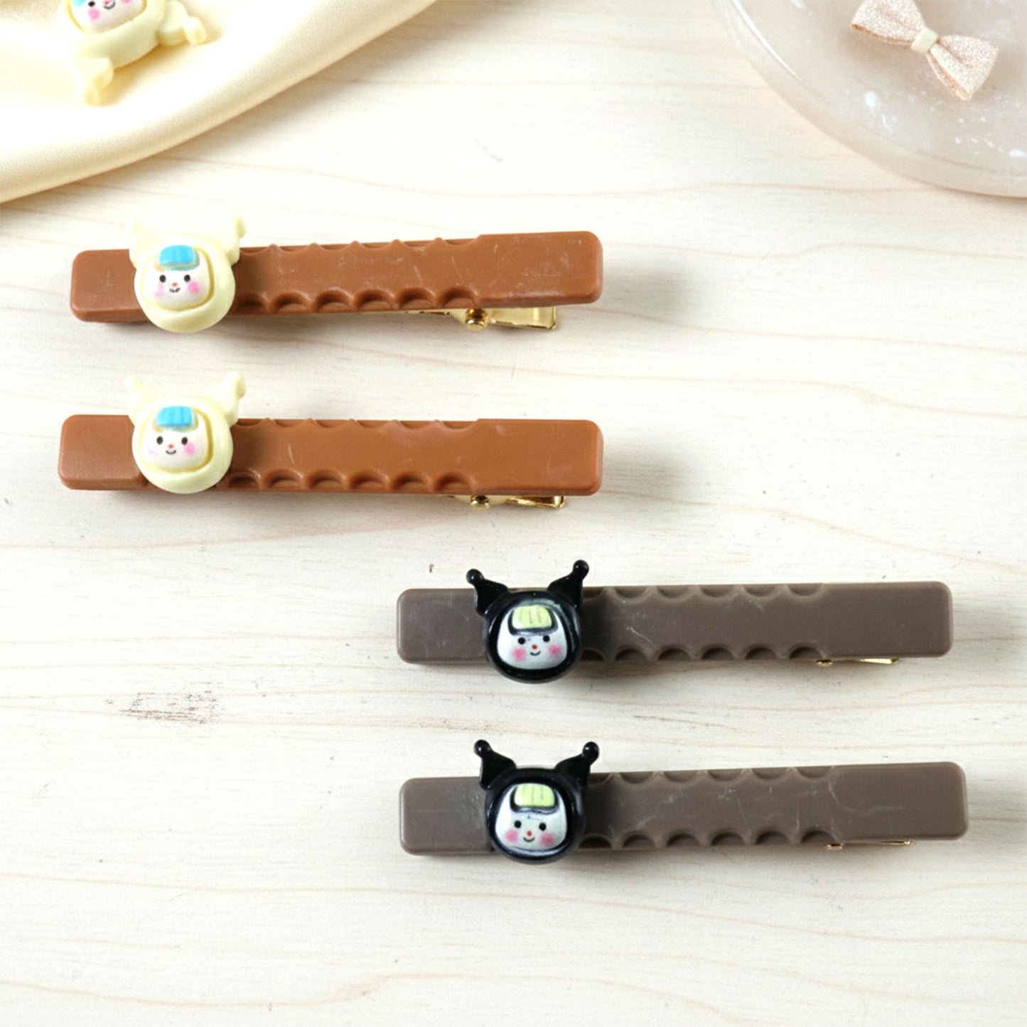 Set of four cute character decorative hair clips by Wukusy featuring colorful, playful designs for children’s hairstyles.