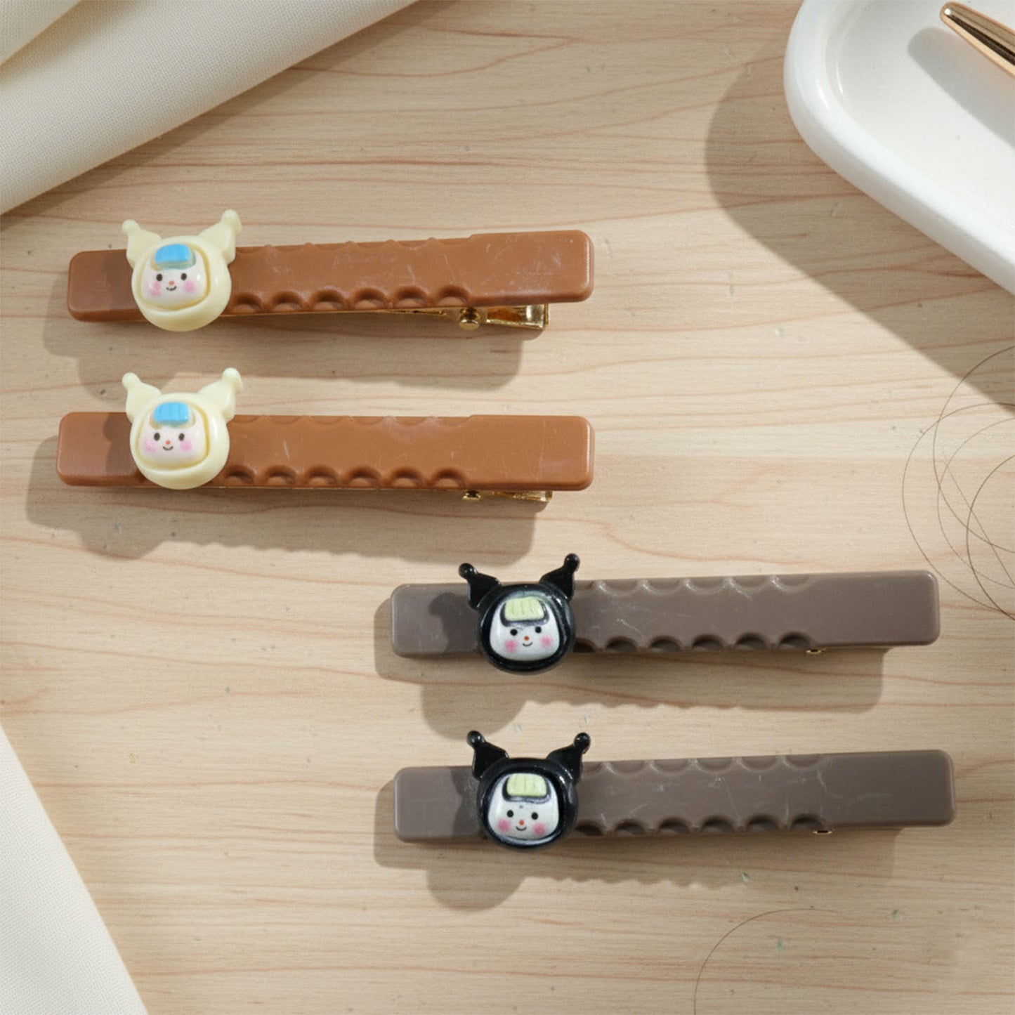 Set of four cute character decorative hair clips by Wukusy, featuring colorful and playful designs for kids' hair accessories.