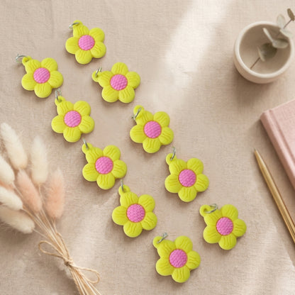 Set of 10 Wukusy cute flower-shaped bag charm keychains featuring colorful, decorative accessories for bags or keys.