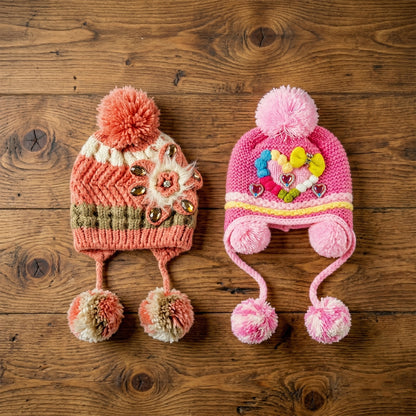 Cute kids' winter woolen ear flap cap with pom-pom by Wukusy, featuring a cozy, colorful mixed design for cold weather.
