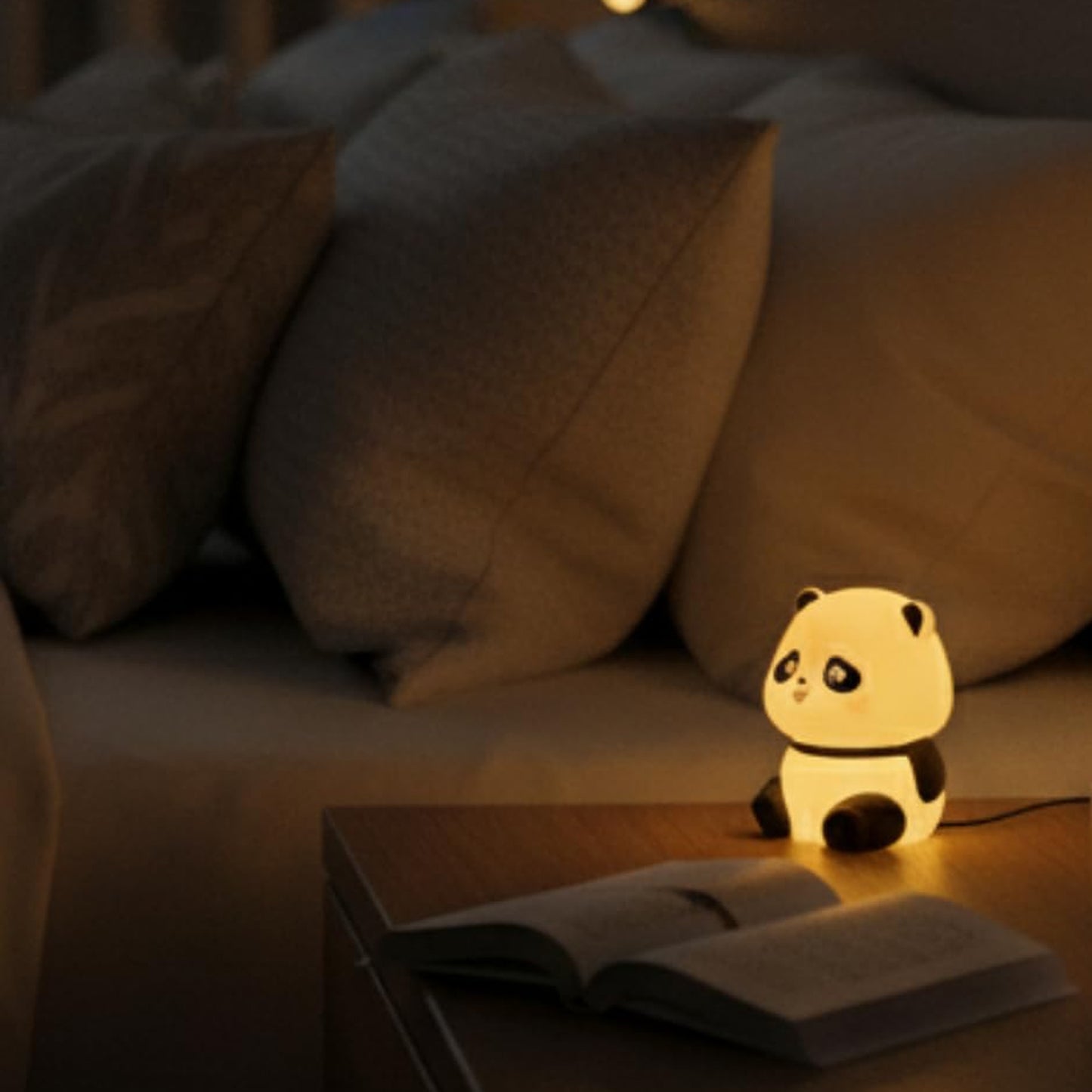 Cute mini panda night light lamp by Wukusy, showing a small panda-shaped LED night light on a dark background.