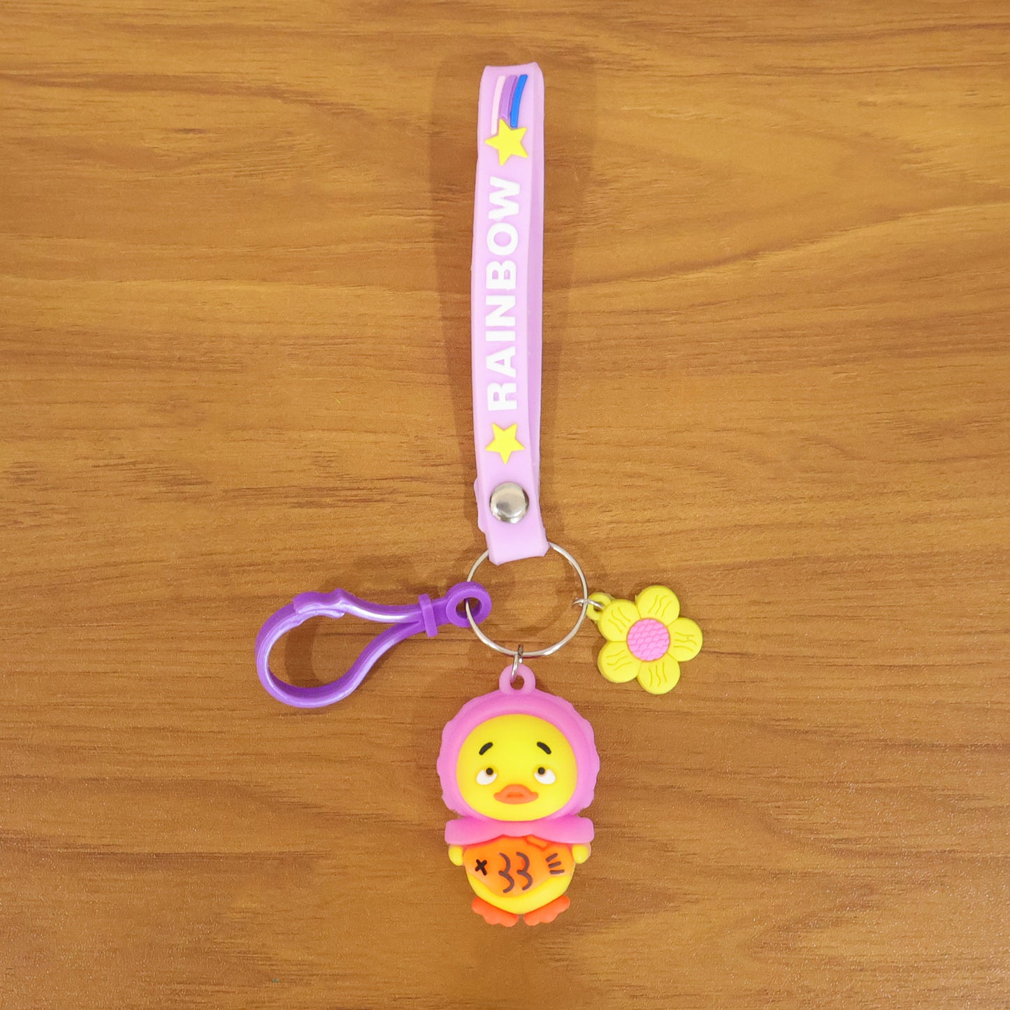 Colorful rainbow strap cartoon duck keychain by Wukusy, featuring a cute duck design on a playful keychain accessory.