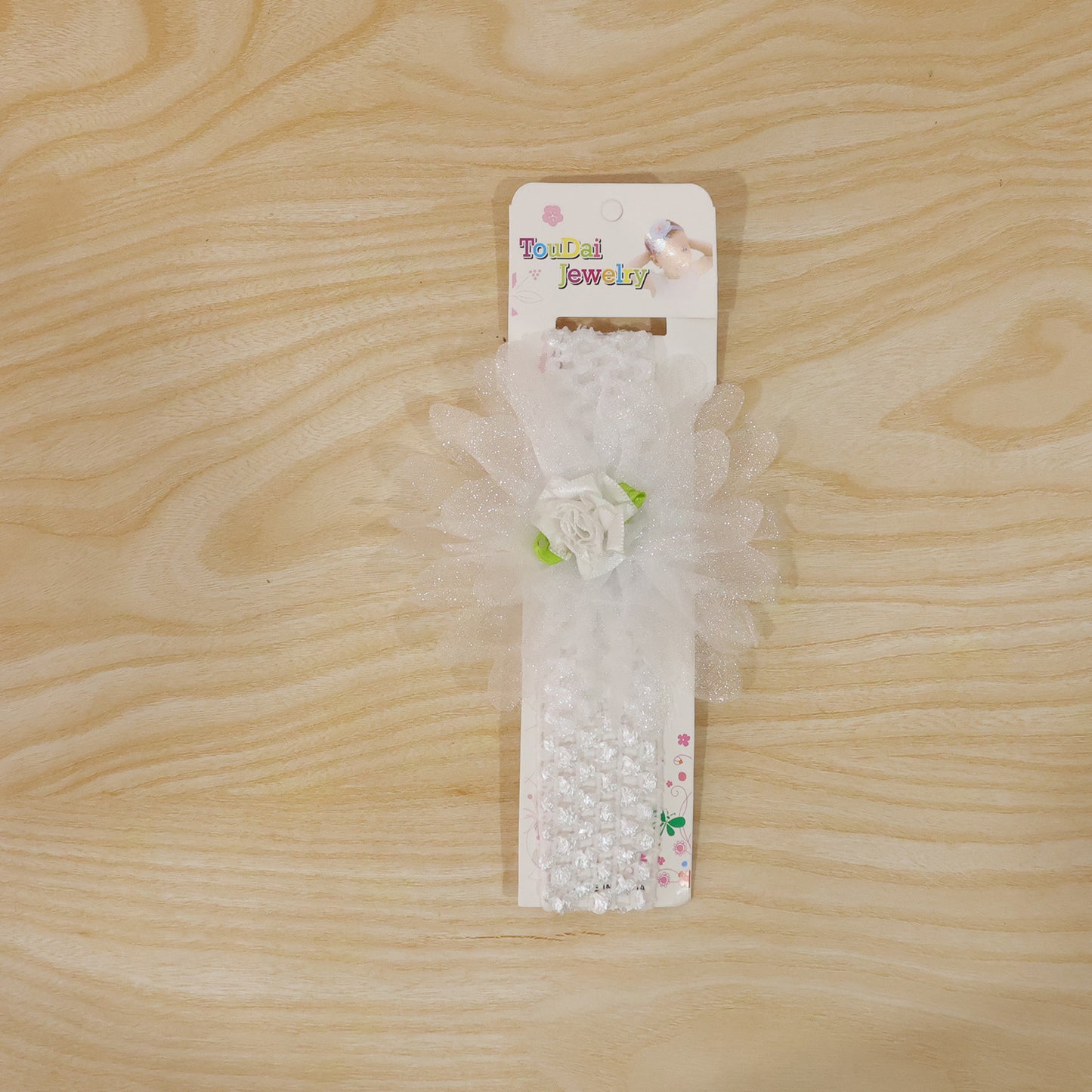 Cute soft elastic floral baby headband by Wukusy, stylish stretchable hair band for infants with colorful floral pattern.