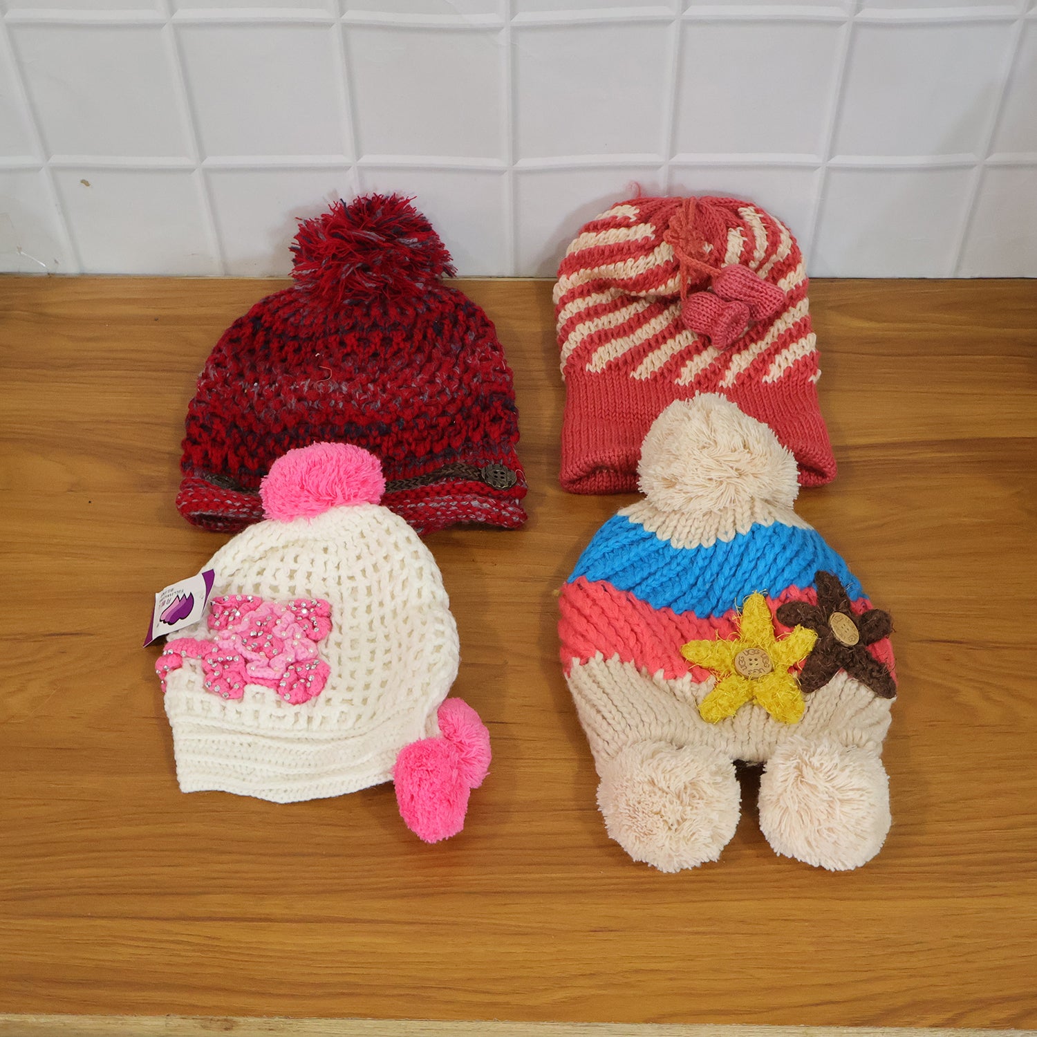 Wukusy cute winter woolen knitted cap for men and women in a mix design, featuring cozy, warm knit fabric and stylish winter look.