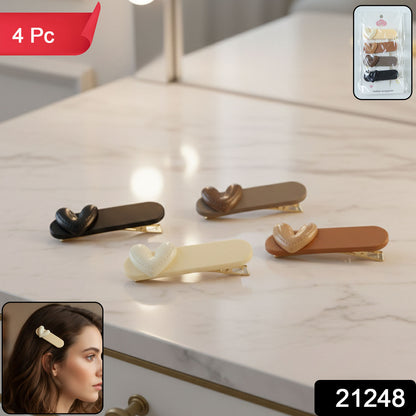 Set of four decorative Wukusy hair clips with floral and geometric designs, perfect for adding style to hair accessories.