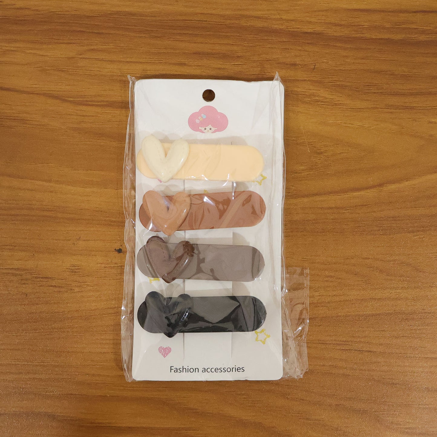 Set of four decorative hair clips by Wukusy, featuring colorful and stylish accessories for versatile hair styling.