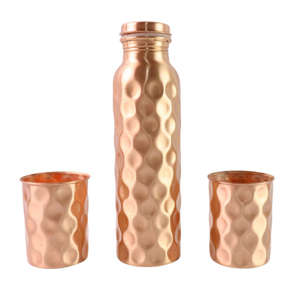 Diamond cut copper water bottle with two glasses and gift box, Wukusy 3-piece set, featuring intricate design and traditional craftsmanship.
