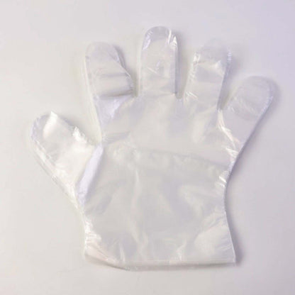 Pair of disposable clear gloves from Wukusy, 50-piece pack, showing the transparent, latex-free gloves suitable for hygiene and safety.