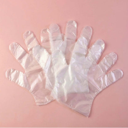 Disposable clear gloves by Wukusy, 50-pack, showing a row of transparent latex gloves for medical, cleaning, or food handling use.