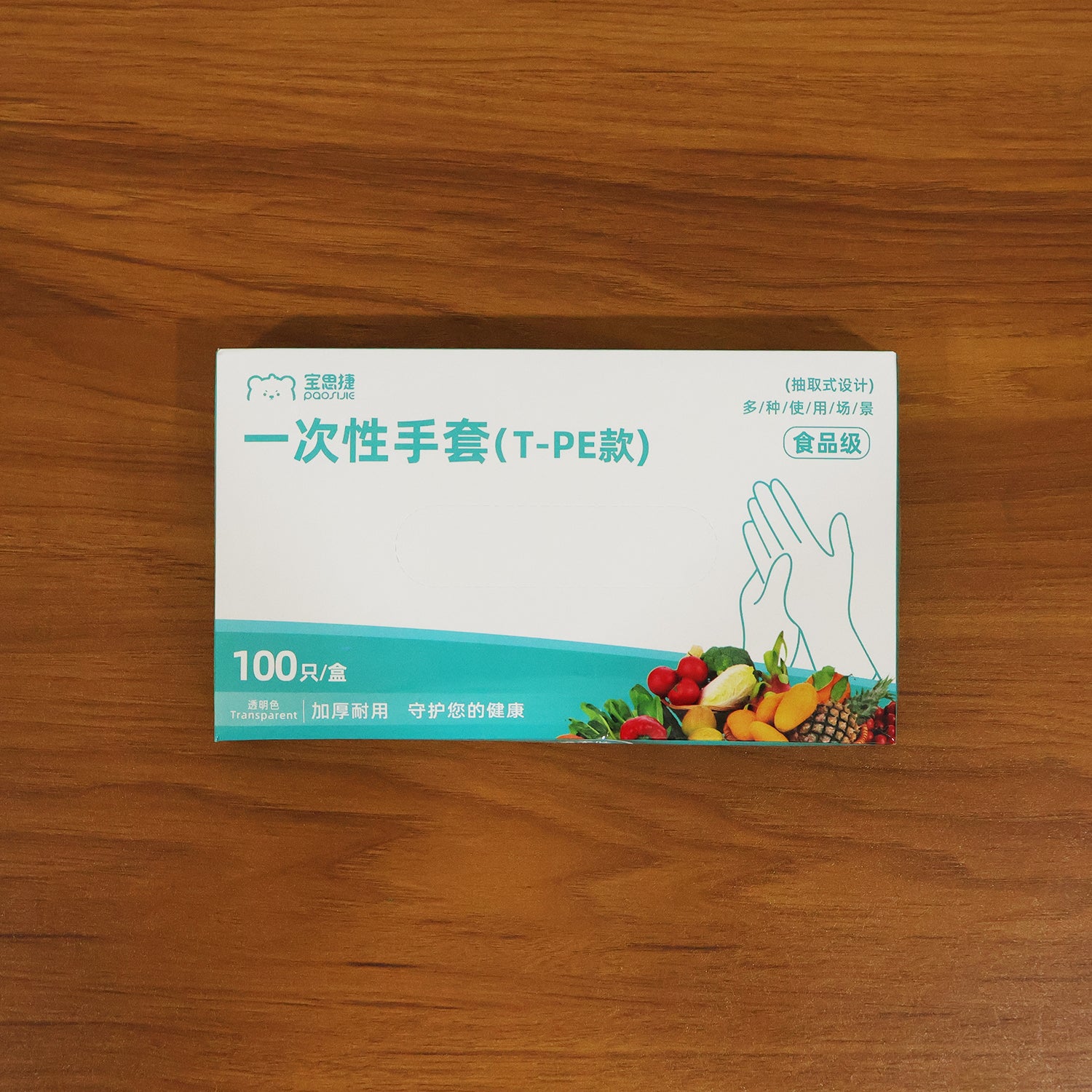 Small size disposable plastic hand gloves by Wukusy, showing 100 clear gloves folded and stacked for protective hand coverage.